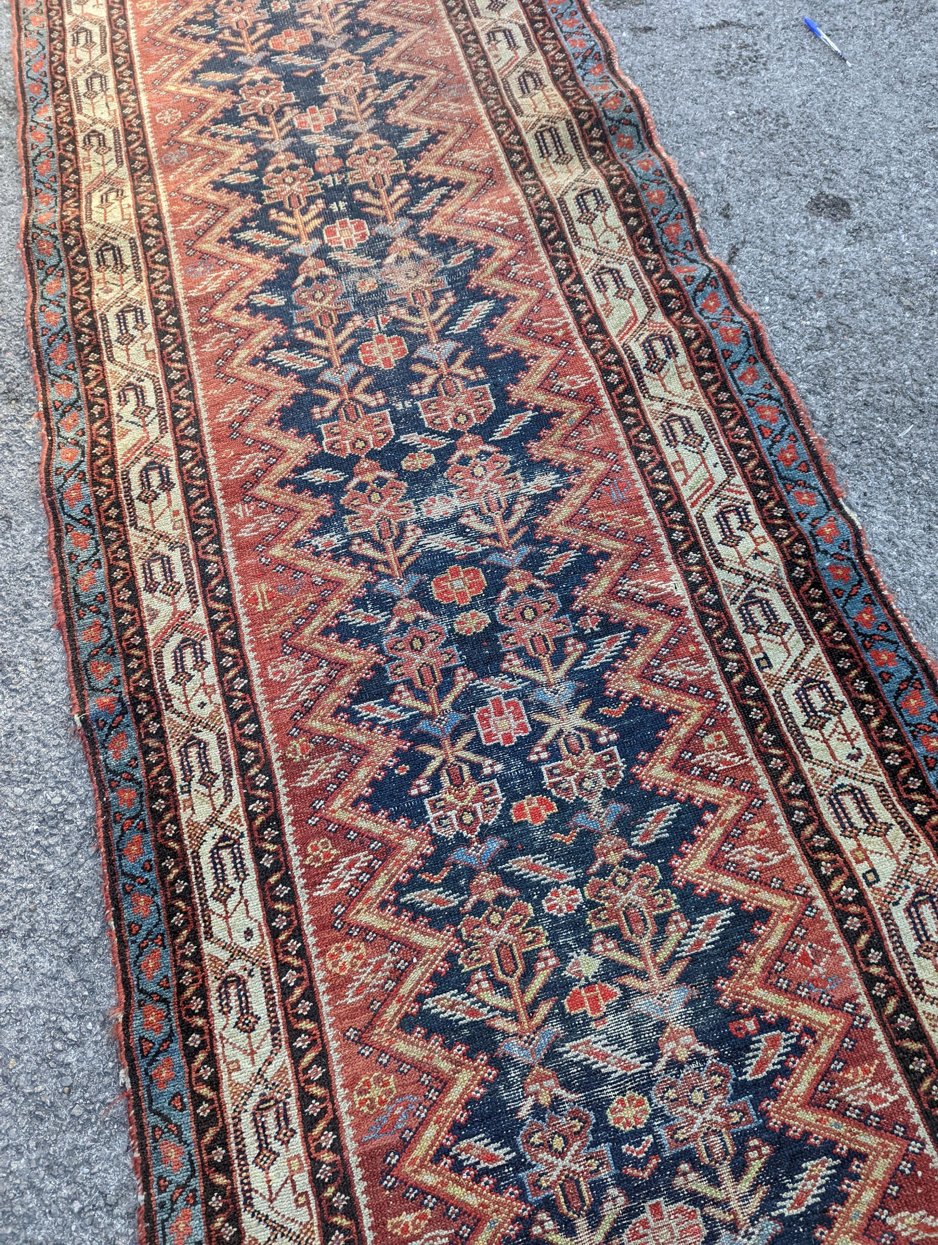 A Caucasian blue ground runner, 372 x 102cm